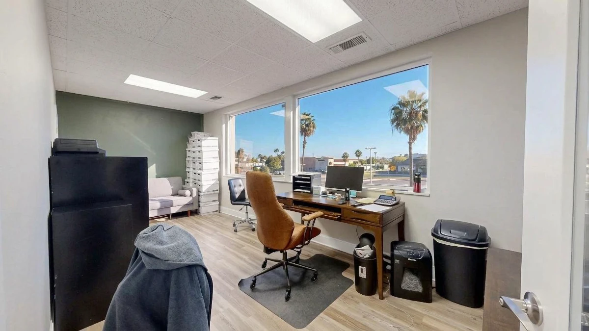 A private office at Cocoa Beach Office with a window onto the palms