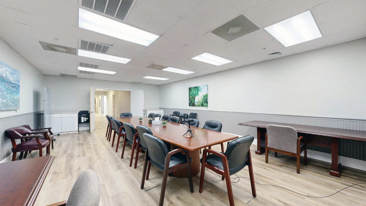 Conference room with a long table seating twelve